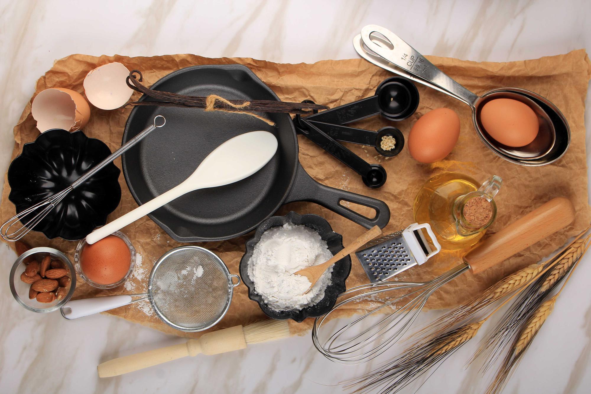 Assorted cooking tools and ingredients on table